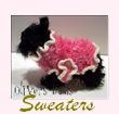 Sweaters for dogs! Casual, dressy, fun dress-up dog sweaters, Funky, Fluffy , and Boa sweaters for your precious pooch.Pink dog sweaters, Lavendar, Purple, Yellow, White, Red, Navy, Brown , Aqua, And Multi-Colored Dog Sweaters. Black and White,Taupe, Girl Dog Sweaters, and Boy Dog Sweaters, Crewneck, Rollneck, Rugby Cotton Dog Sweaters. Cute Cable Knit , Jacquard Knits, Striped Dog Sweaters. 3 in 1 Krisybelle, Granny Patch sweater, Warm Dog Sweaters for your urban canine. Our dog boutique has the latest in upscale Dog Fashion!